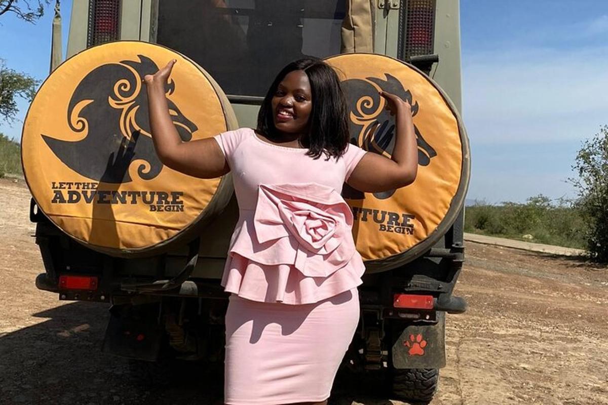 a woman standing in front of a truck