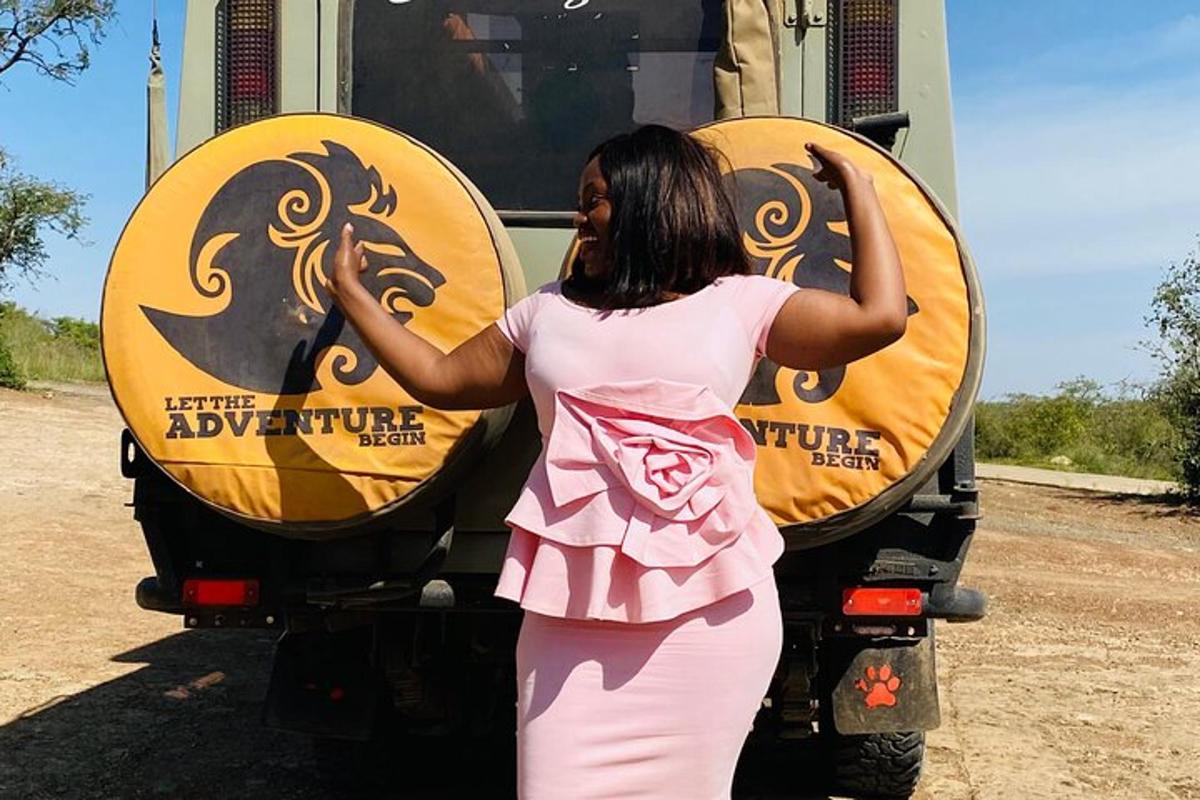 a girl is standing in front of a truck
