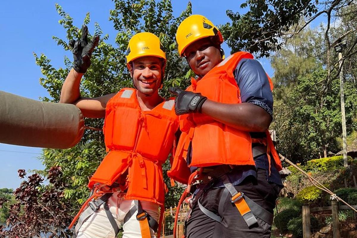 two men wearing hard hats and orange safety vests