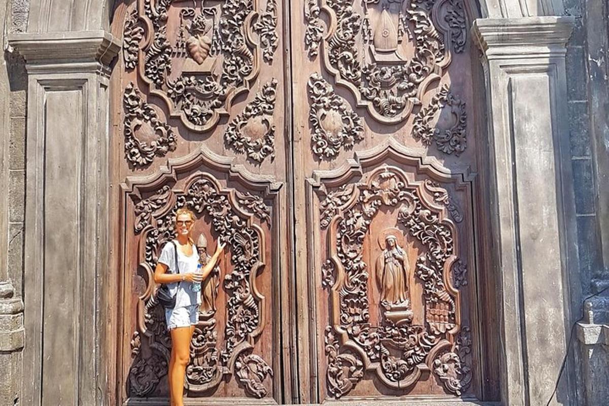 a man standing in front of a wooden door