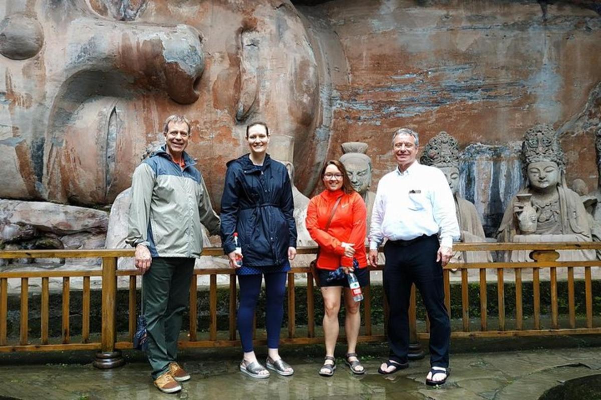 a group of people standing in front of a statue