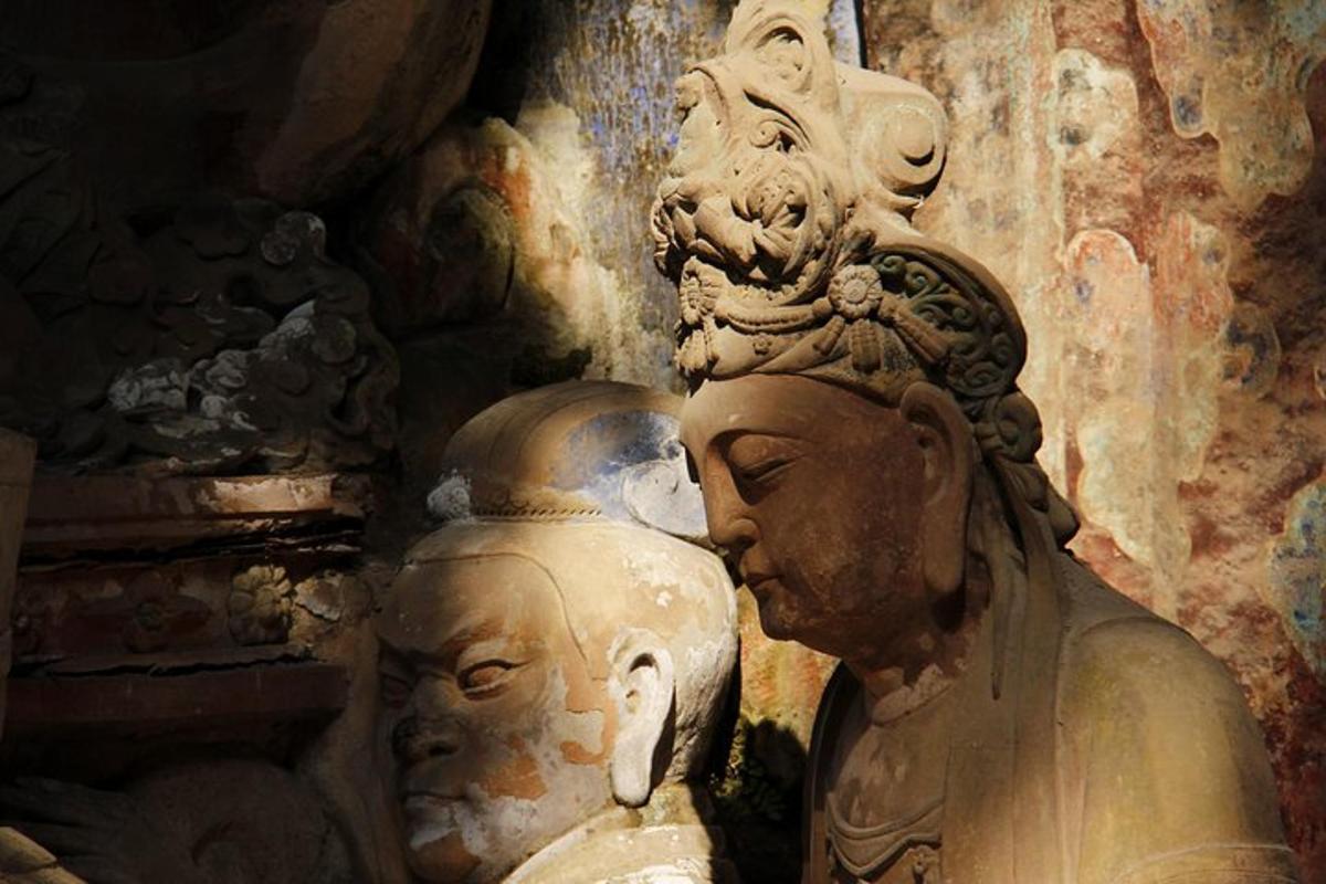 two statues sitting next to each other in a room