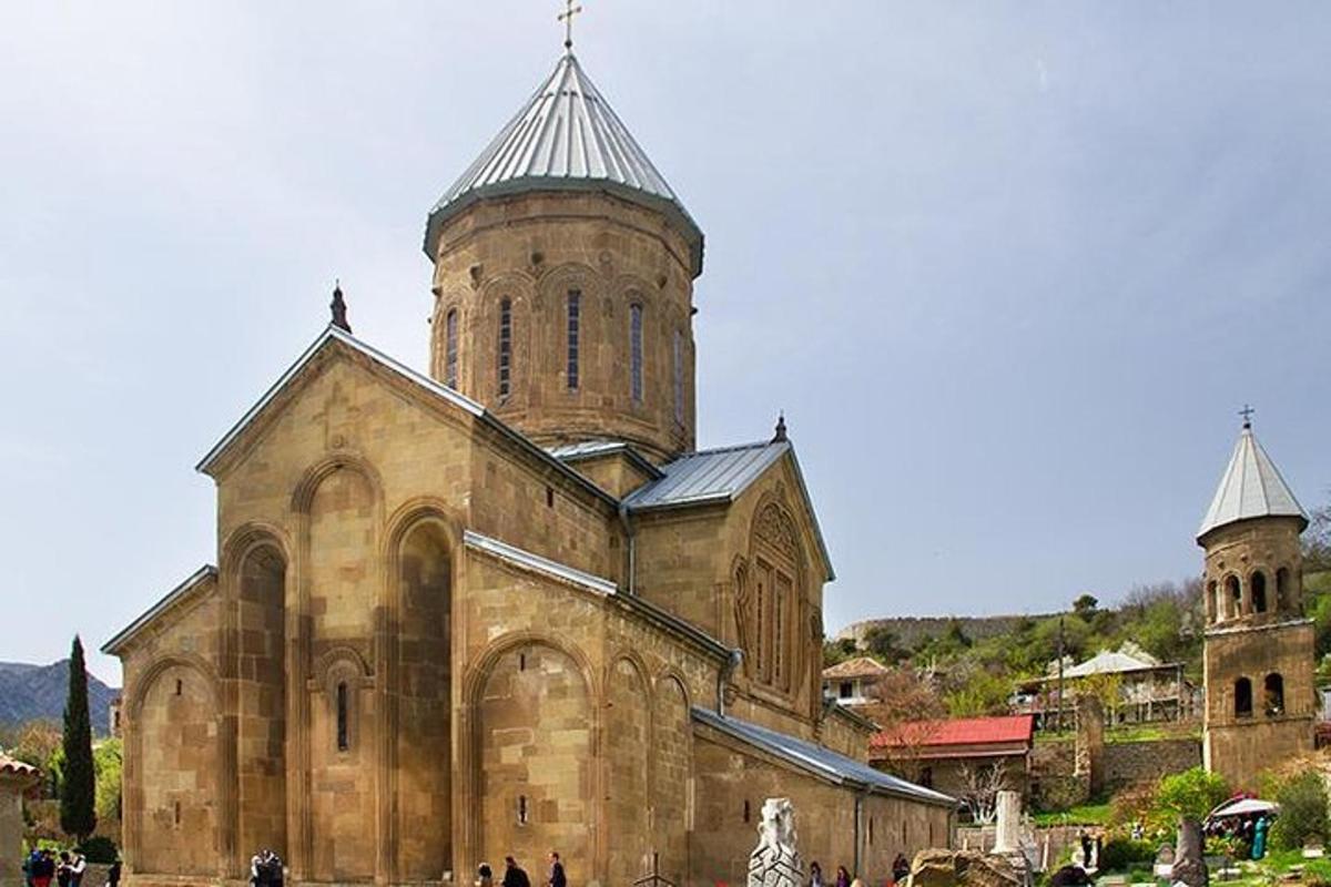 an old stone church with a tower and a steeple