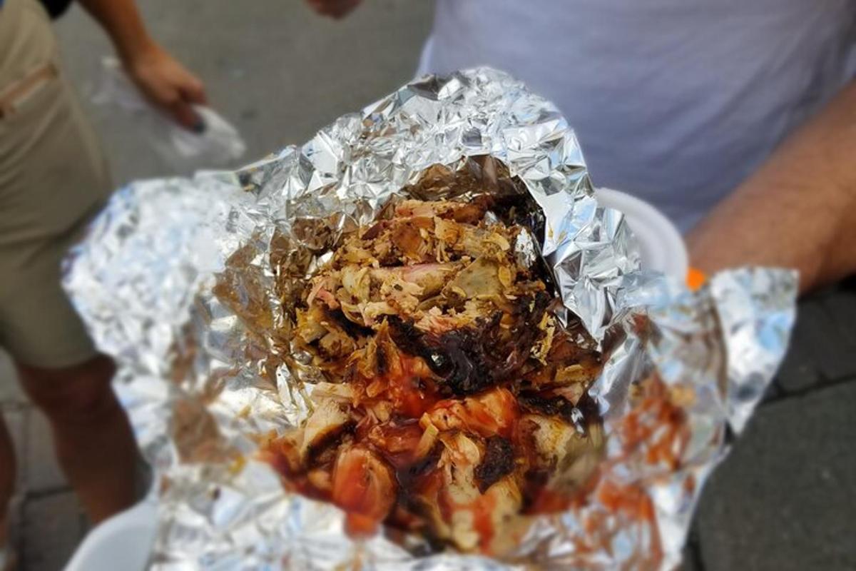 a piece of food wrapped in tin foil