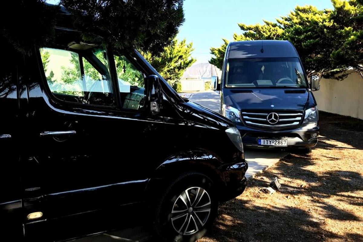 a black truck parked next to a van