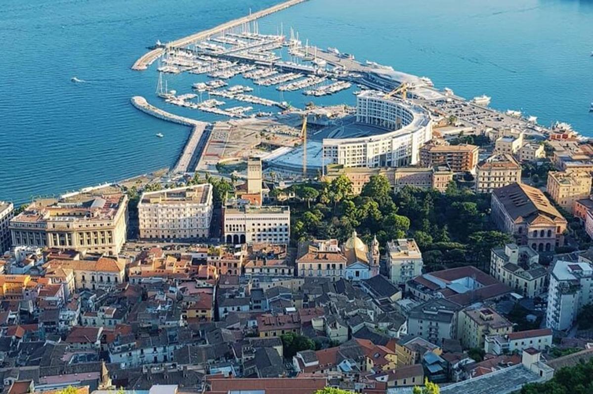 an aerial view of a city with a harbor