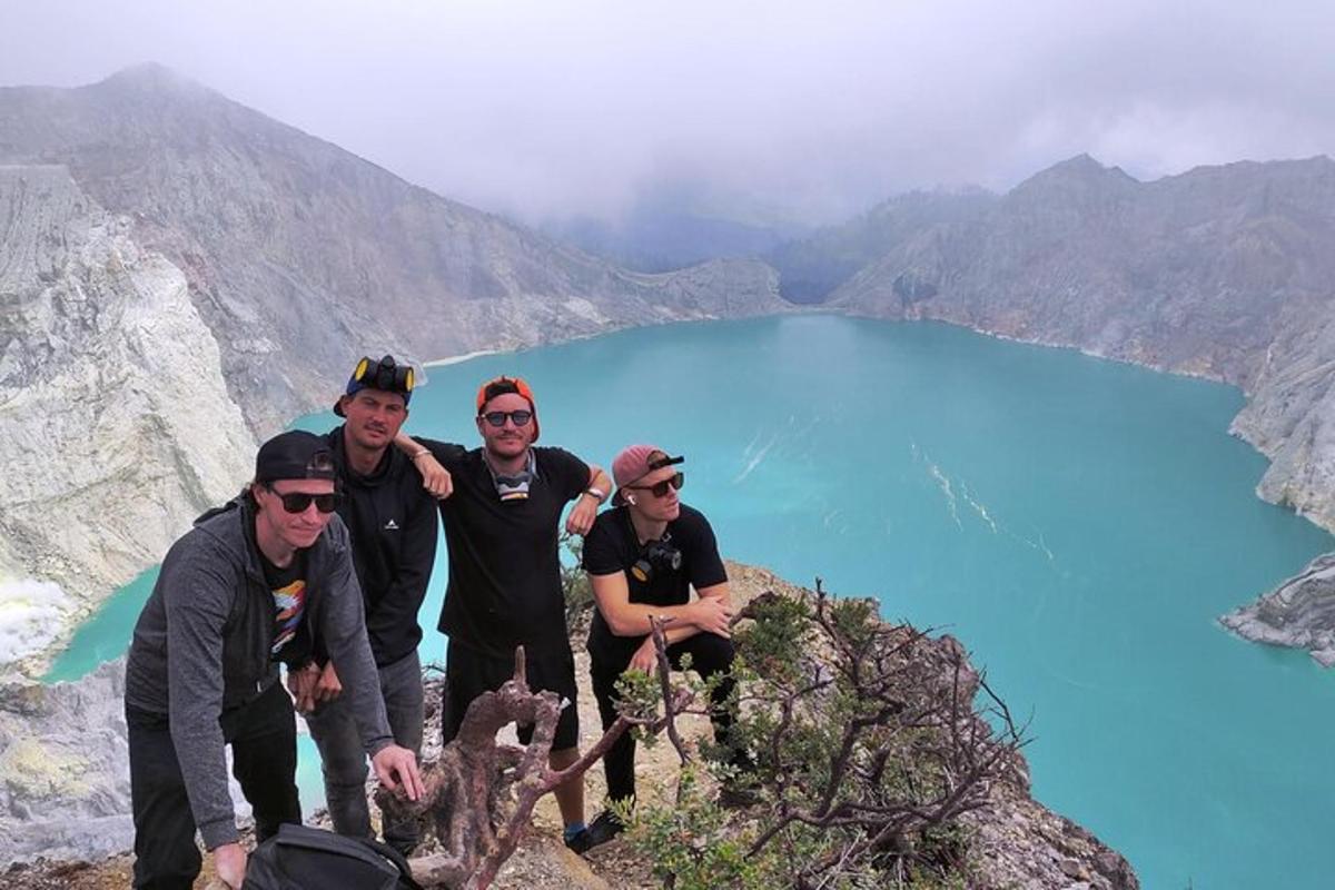 a group of people standing on top of a mountain