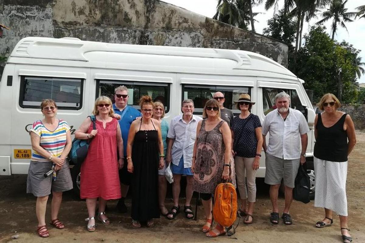 a group of people standing in front of a van