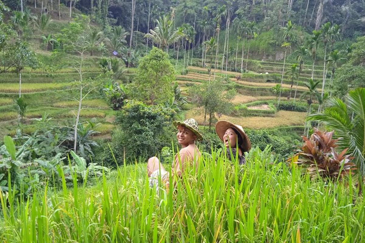 two people sitting in a field of tall grass
