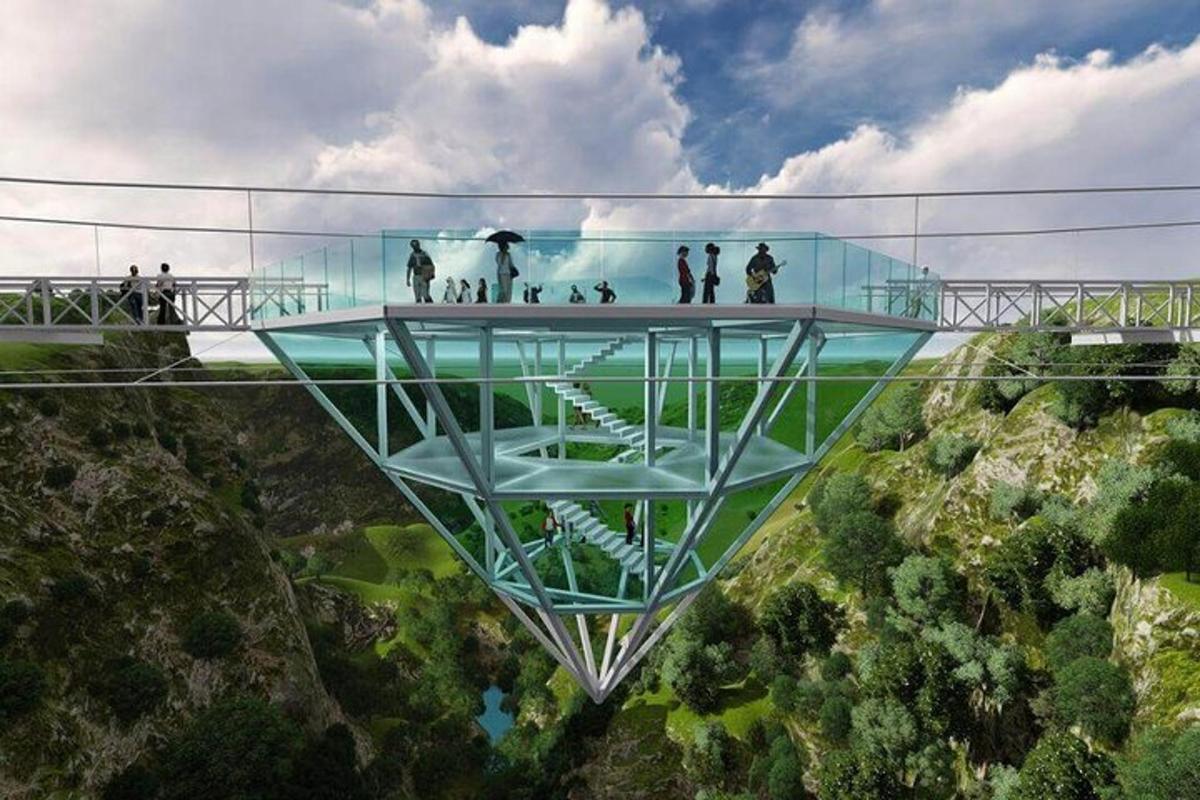people standing on a glass bridge over a mountain