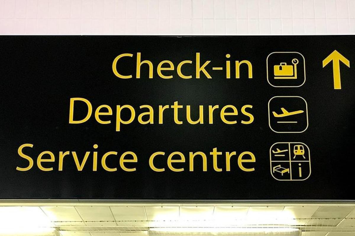 a sign that reads check in departments service centre
