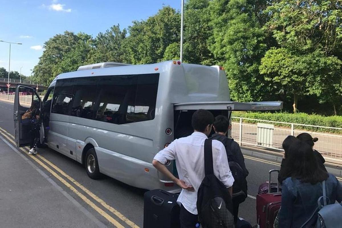 a group of people getting off of a van