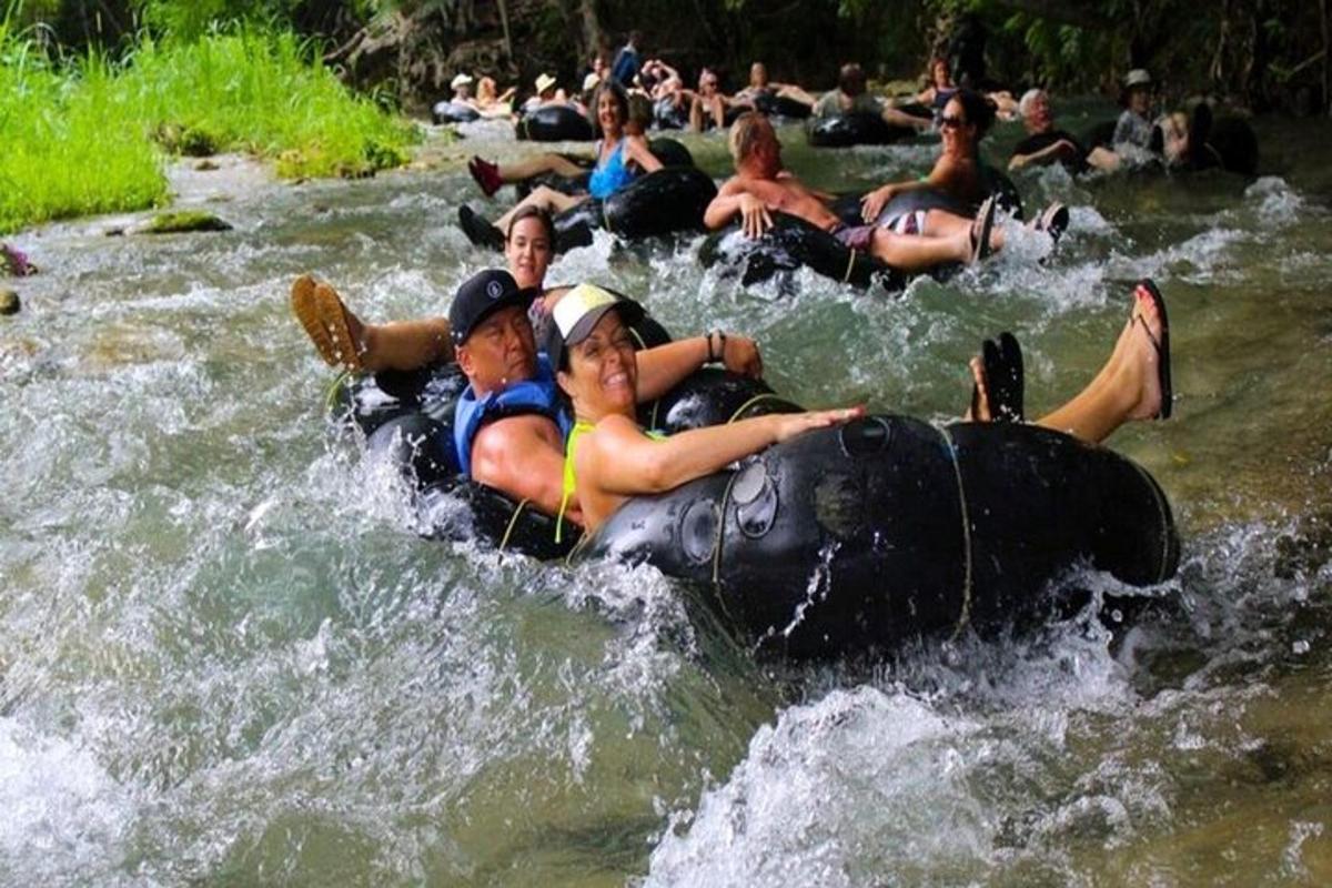 a group of people on a raft in a river