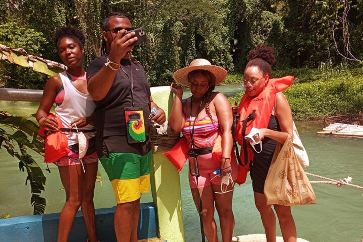 a group of people standing on the side of a boat