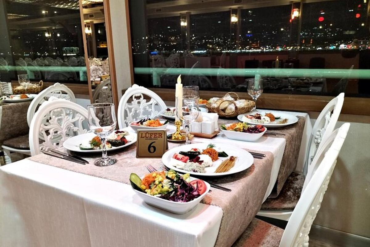 a table with plates of food on it with a view