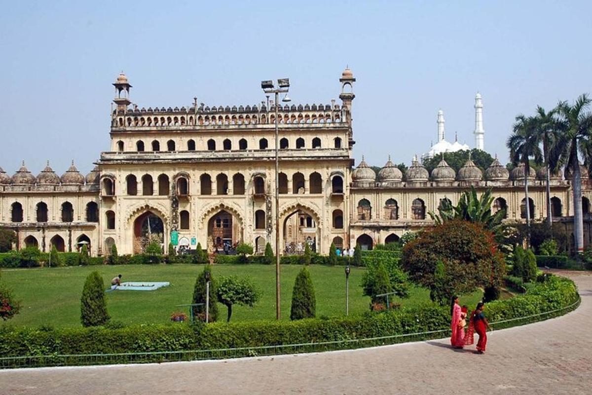 two people standing in front of a large building