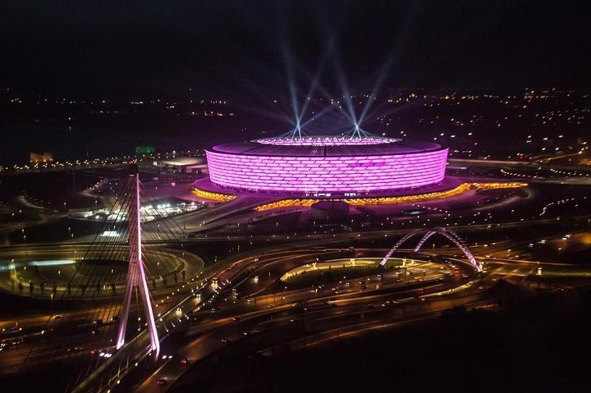 a large round building with lights on it at night