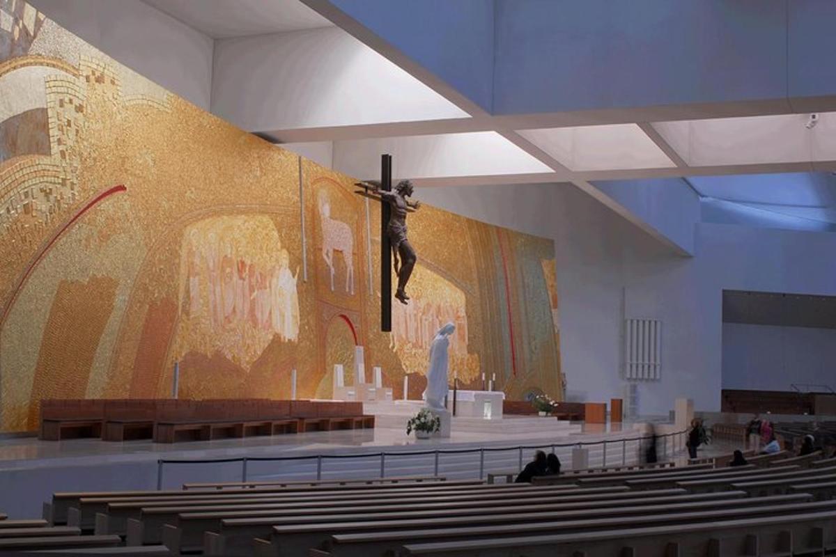 a large church with a large painting on the wall