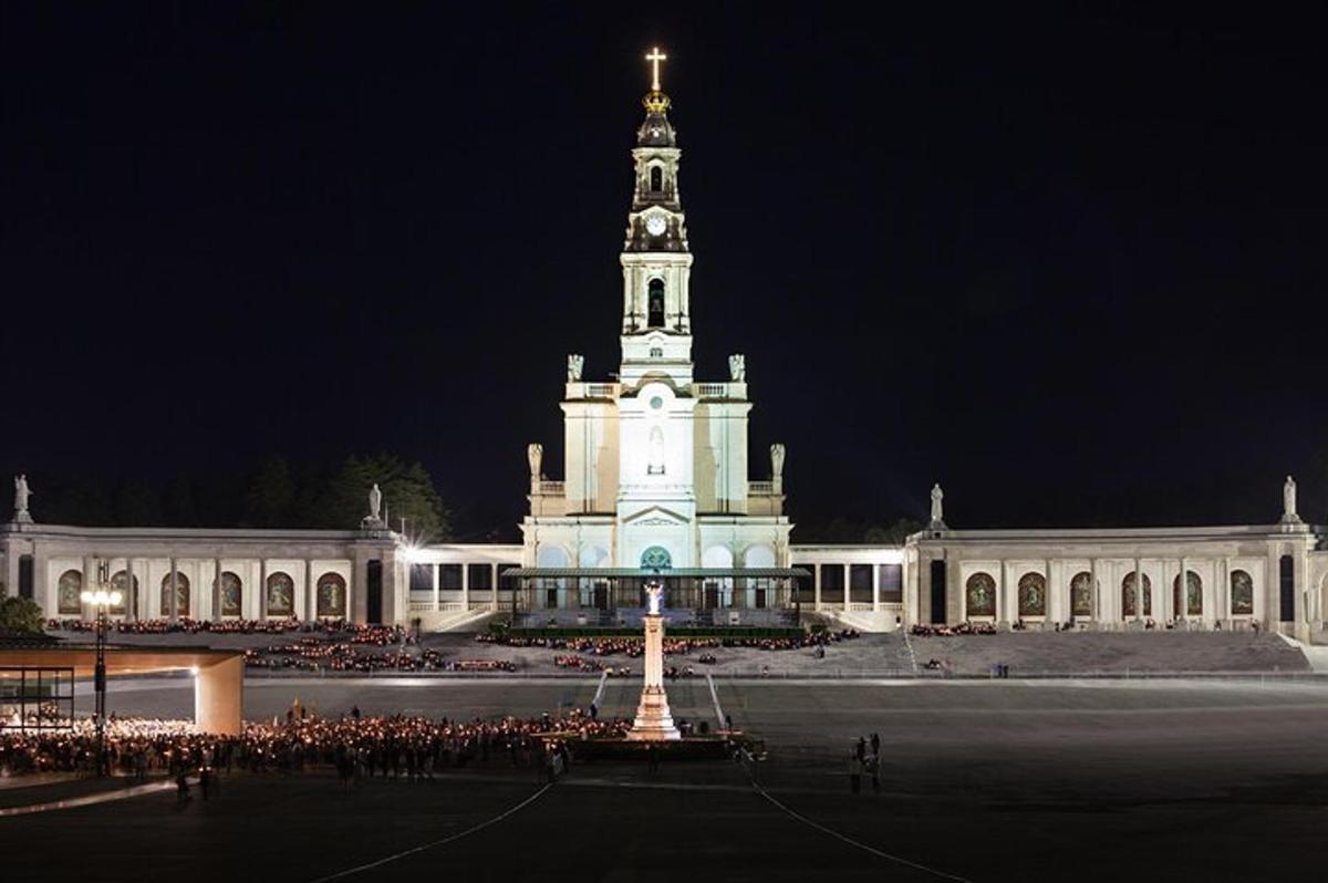 a large building with a clock tower at night