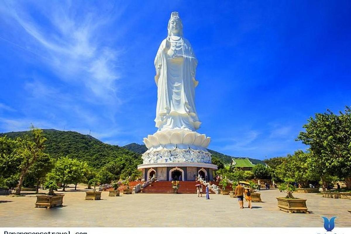 a large statue in the middle of a park