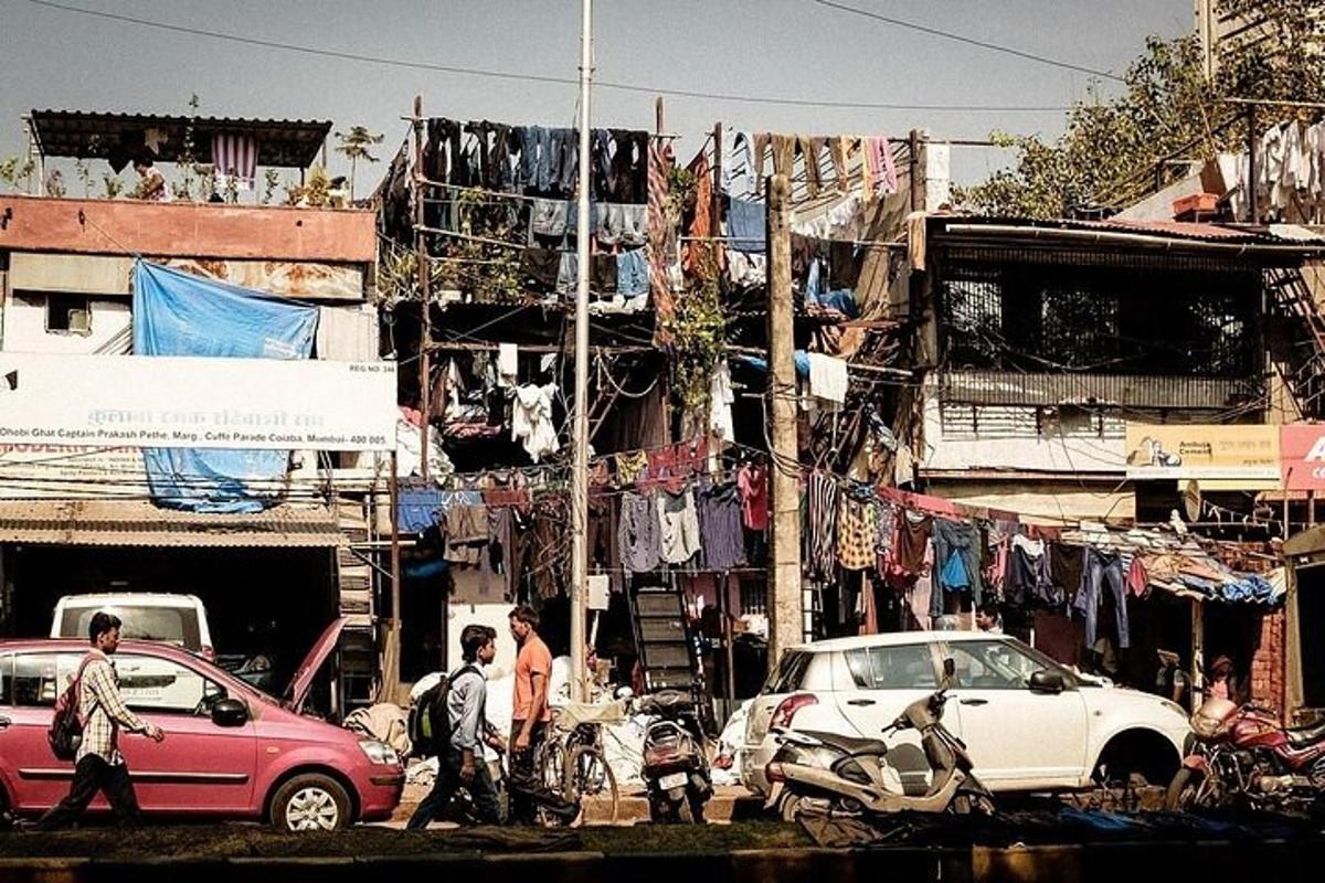 a busy city street with cars and people and clothes
