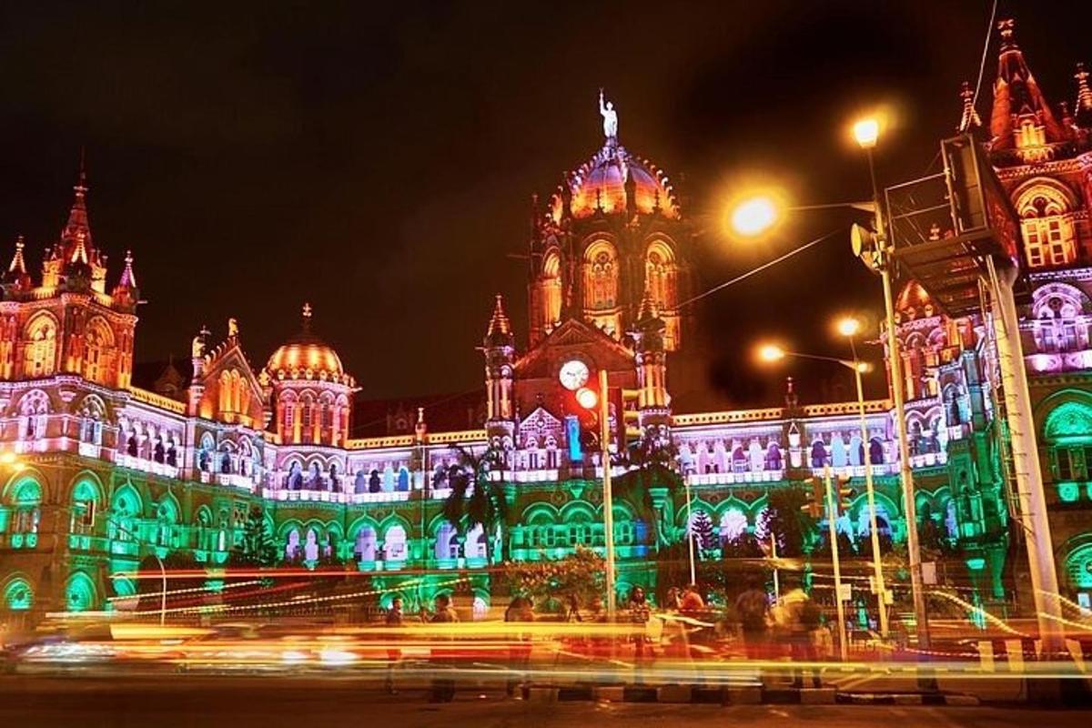 a large building with green and white lights on it