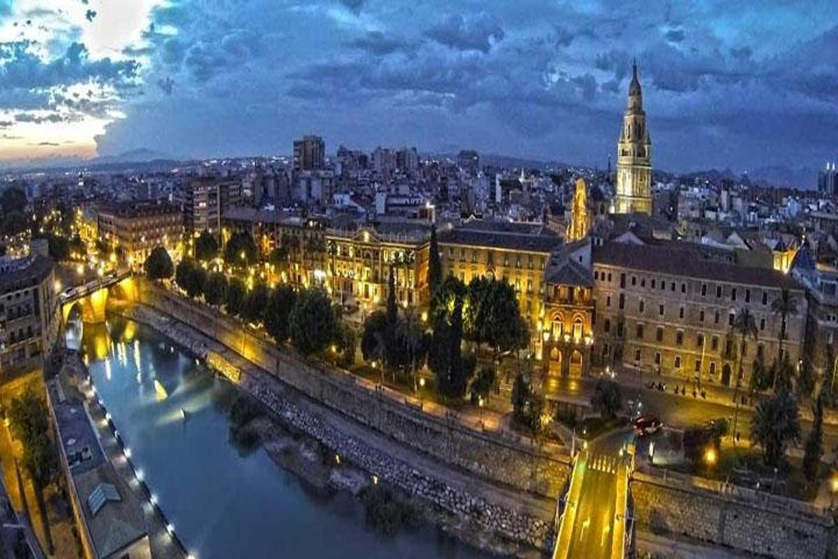 a view of a city at night with a river