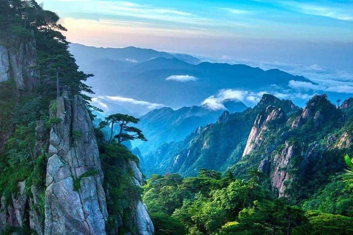 a mountain with a tree on top of it