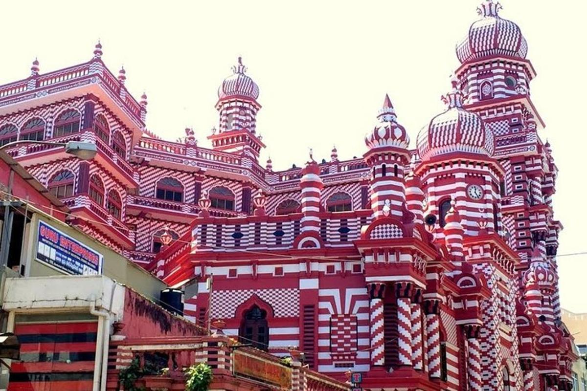 a red and white building with two towers