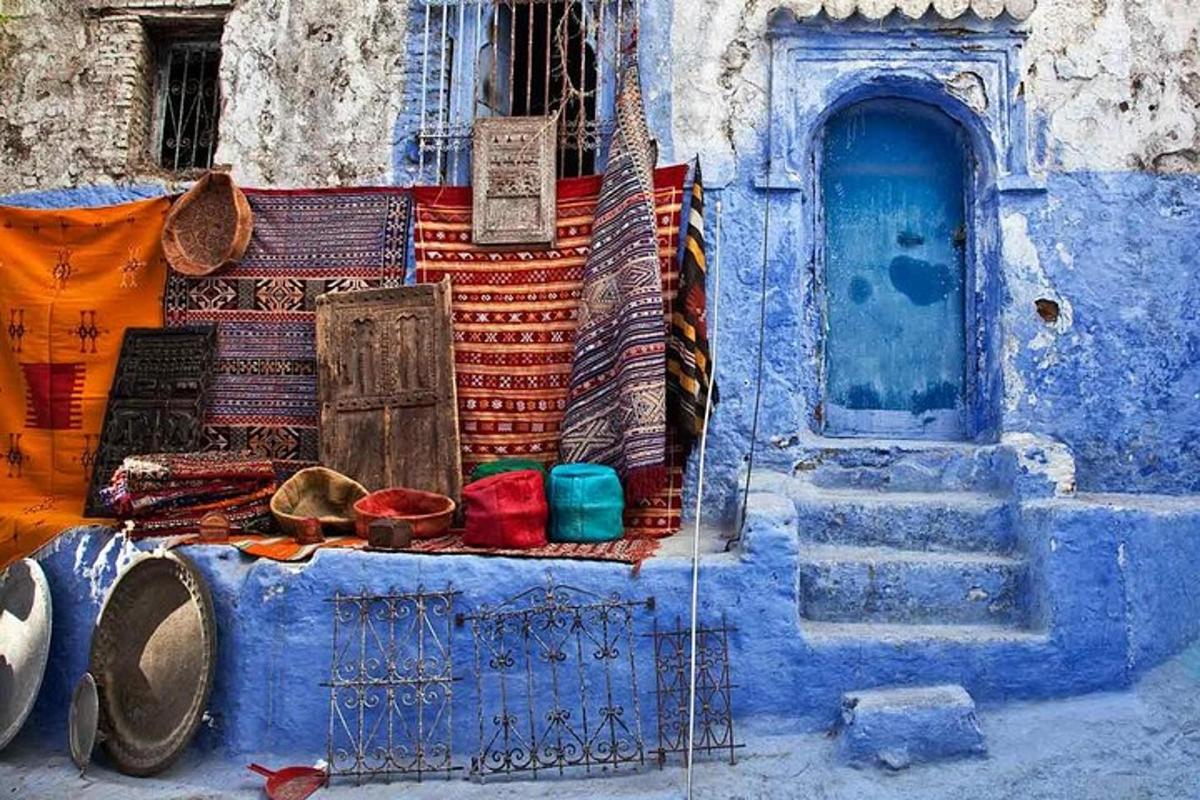 a blue building with a blue door and some objects