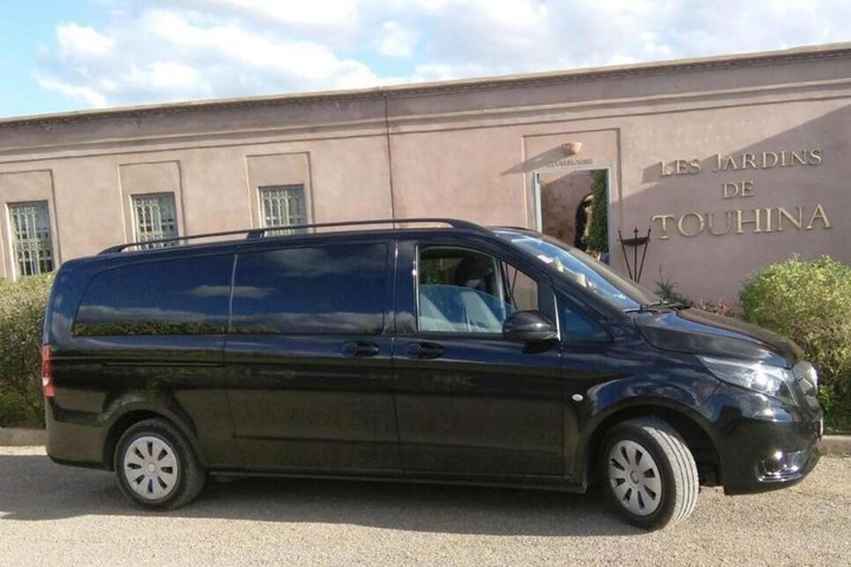 a black van parked in front of a building