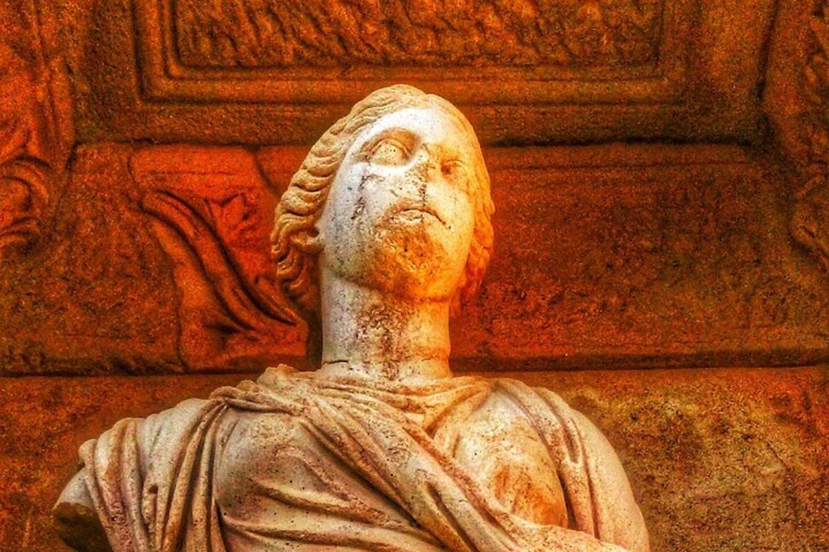 a statue in front of a wall
