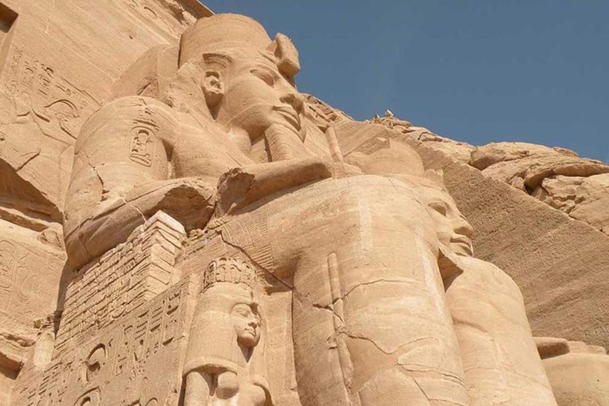 a large sand sculpture of a statue on a building