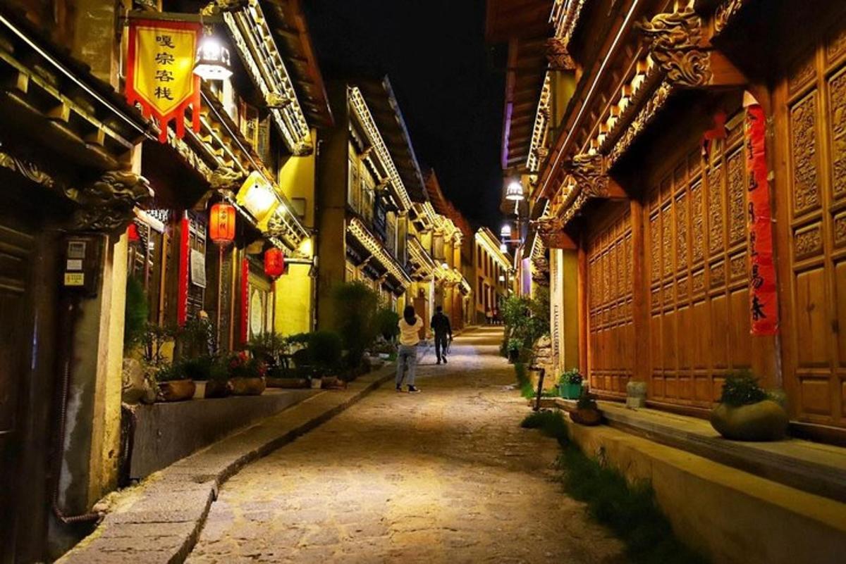 a person walking down a street at night
