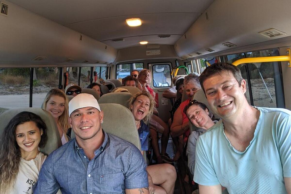 a group of people sitting in a bus