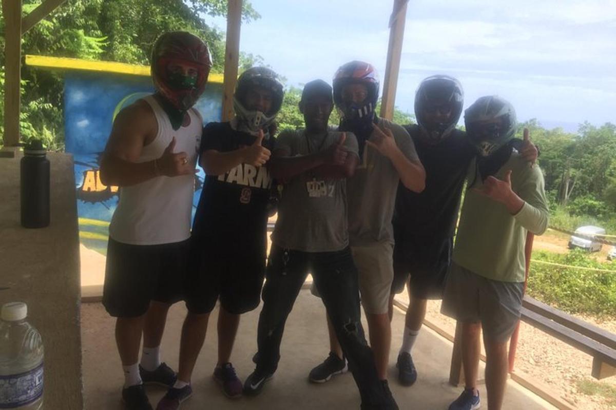 a group of people wearing helmets posing for a picture