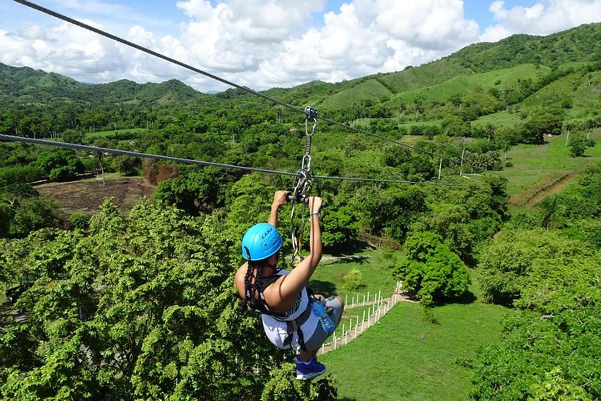 a woman is hanging on a zip line
