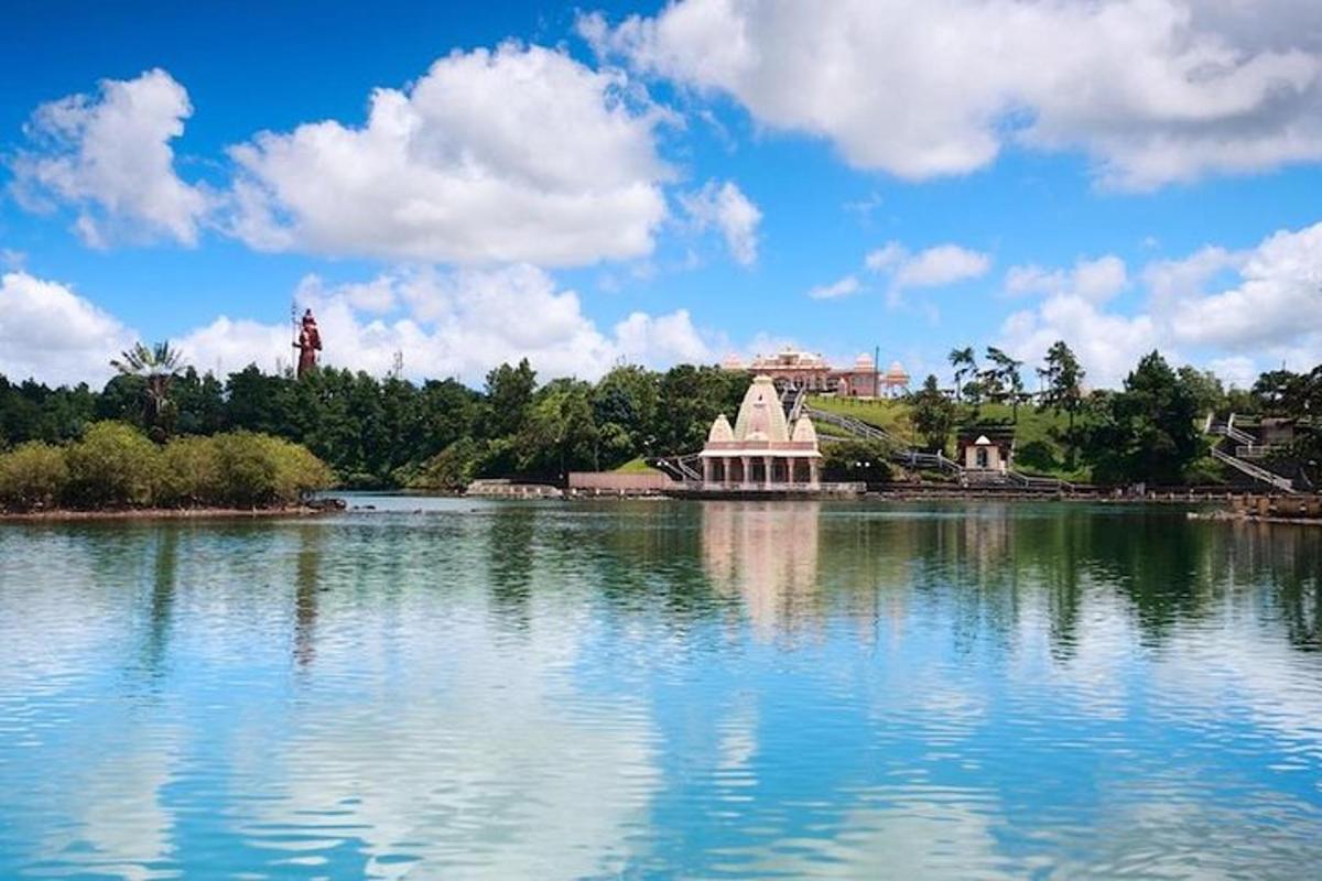 a large lake with a building in the middle of it
