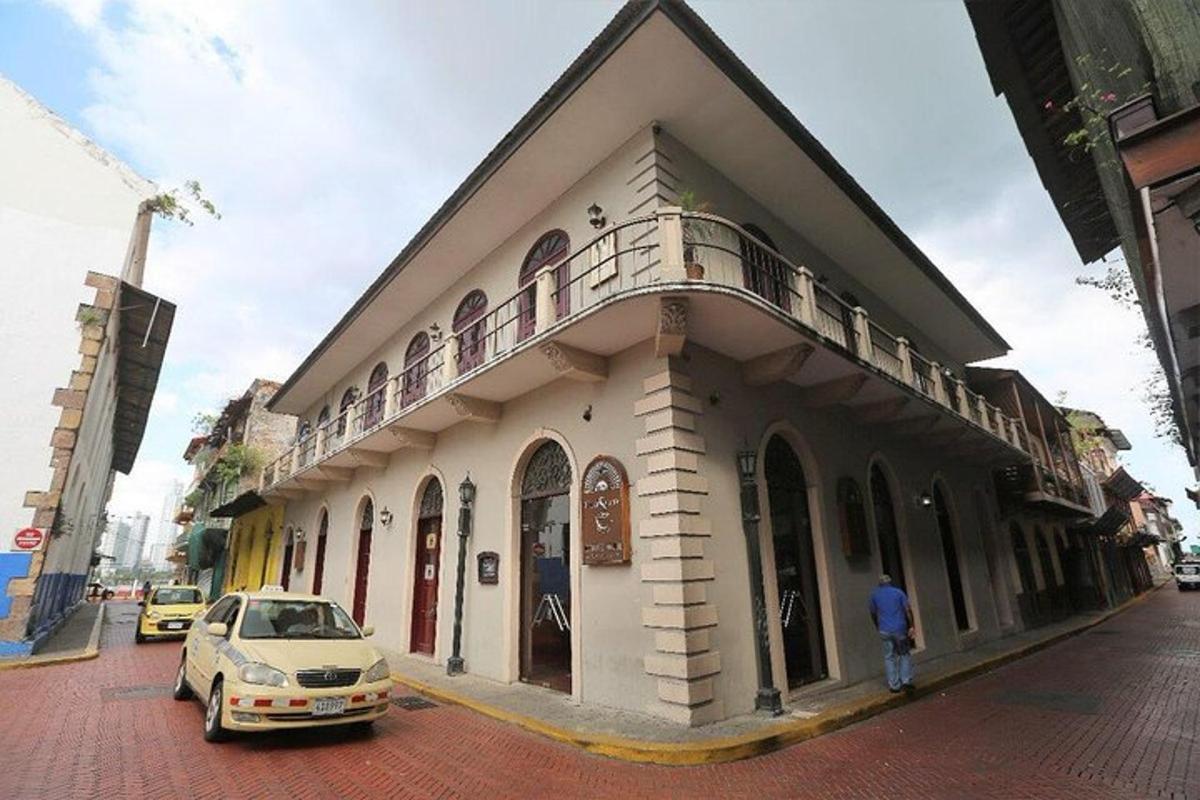 a car parked in front of a building on a street