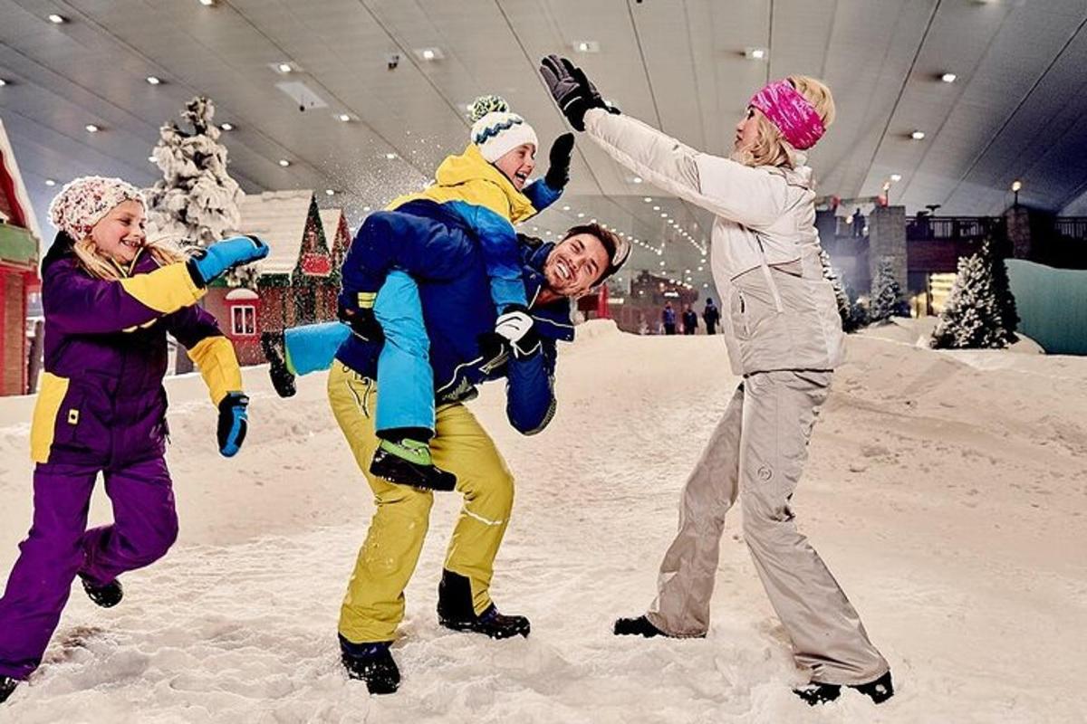 a group of people playing in the snow