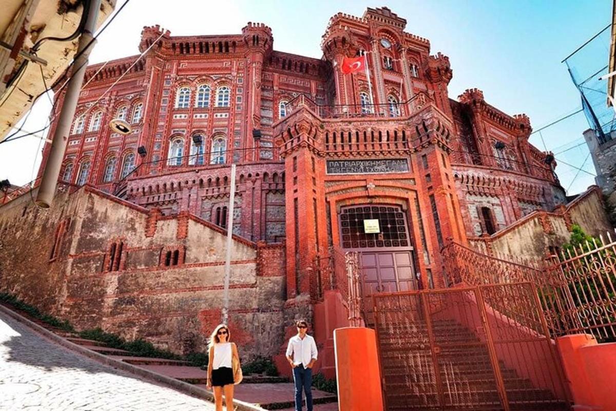 two people standing in front of a large building