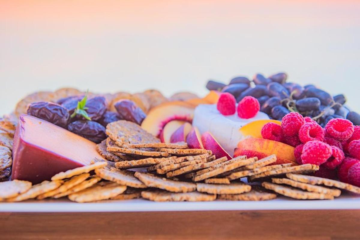 a plate of different types of snacks and fruit