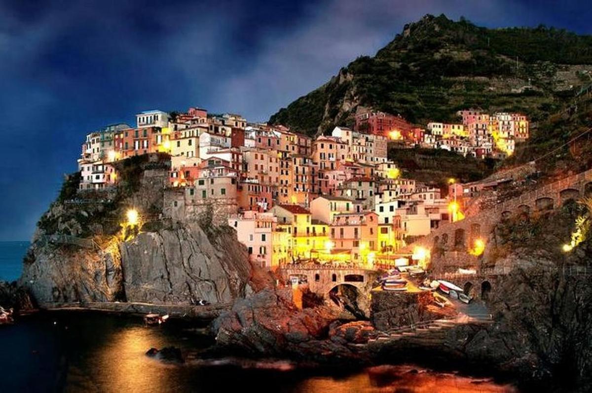 a town on top of a mountain at night