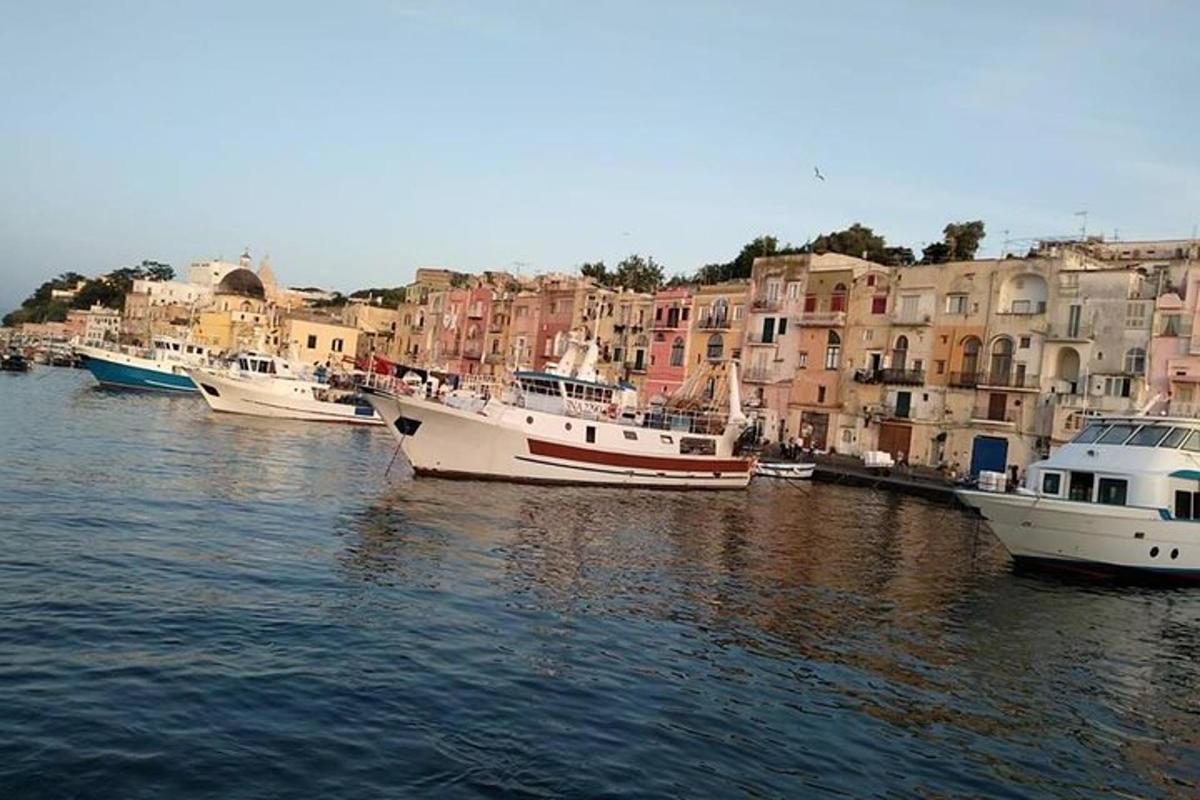 a group of boats in the water near buildings