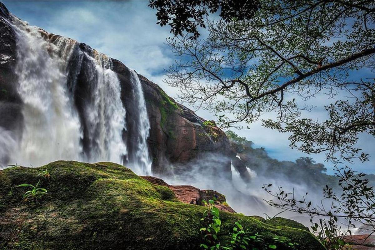 a waterfall on the side of a mountain