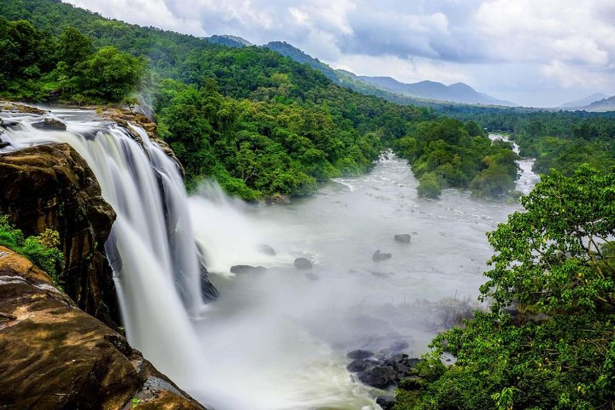 a waterfall in the middle of a river