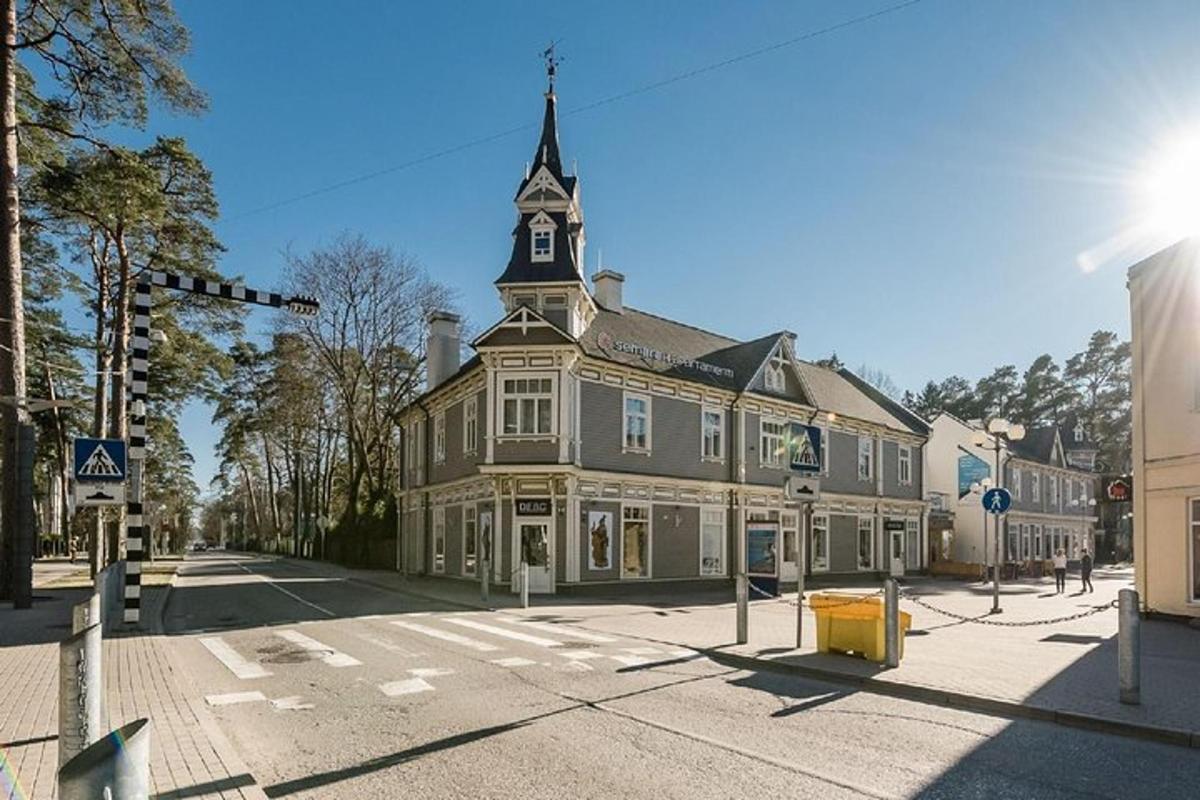 a large building with a tower on a street