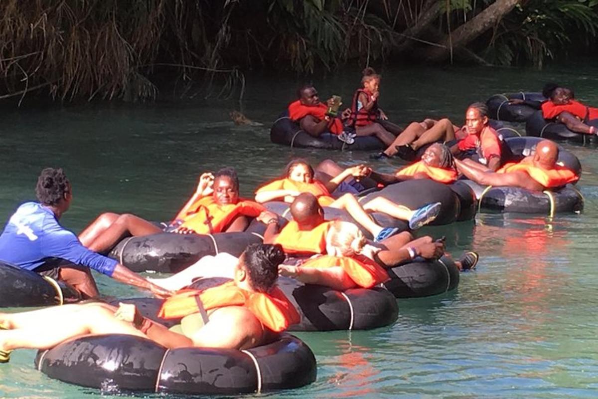 a group of people riding on tubes in the water