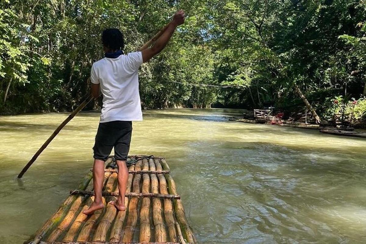 a man is standing on a raft in the water
