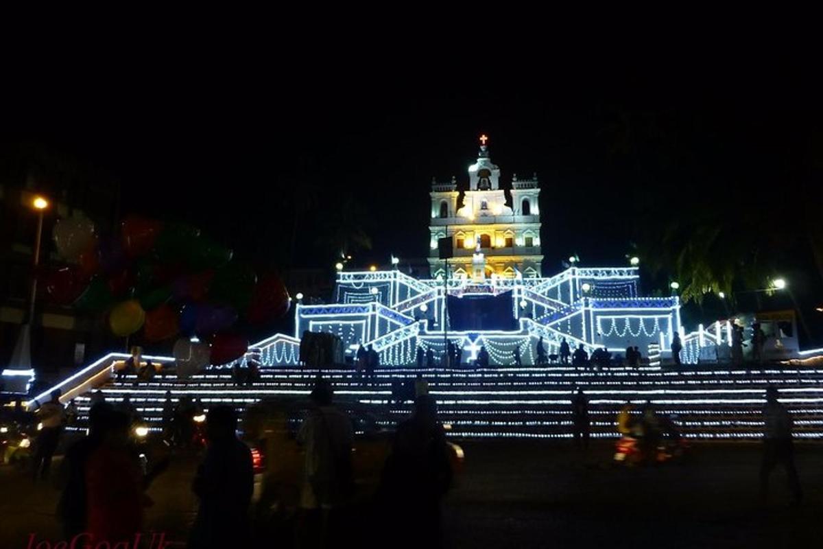 a large building with lights in front of it at night